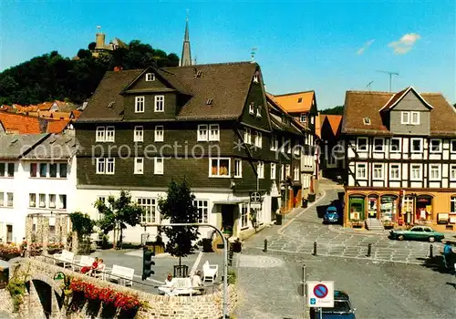 AK / Ansichtskarte Biedenkopf Innenstadt Luftkurort Marktplatz Blick zum Schloss Biedenkopf