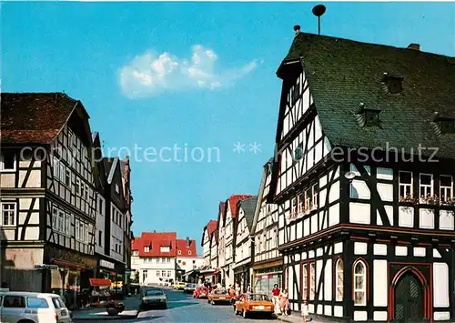 AK / Ansichtskarte Schotten_Hessen Marktstrasse am alten Rathaus Fachwerkhaeuser Luftkurort Naturpark Hoher Vogelsberg Schotten Hessen