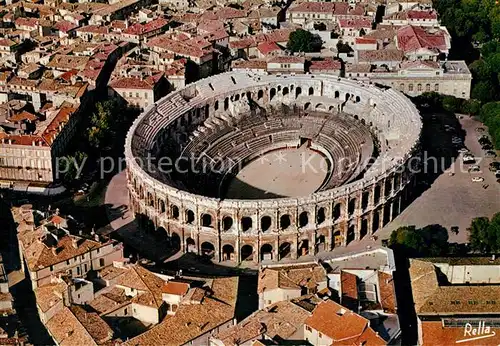 AK / Ansichtskarte Nimes Vue aerienne des Arenes Nimes