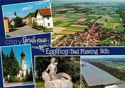 AK / Ansichtskarte Egglfing_Inn Hauptstrasse Kirche Skulptur Fliegeraufnahme Egglfing Inn