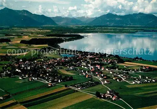 AK / Ansichtskarte Chieming_Chiemsee Blick zum Wilden Kaiser und Kampenwand Alpen Fliegeraufnahme Chieming Chiemsee