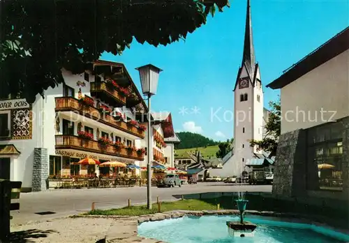 AK / Ansichtskarte Abtenau Marktplatz Brunnen Kirche Gasthof Abtenau