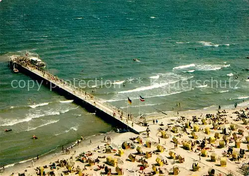 AK / Ansichtskarte Timmendorfer_Strand Strand Seebruecke Ostseeheilbad Fliegeraufnahme Timmendorfer_Strand