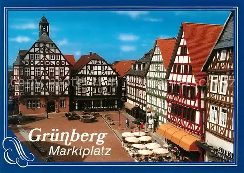 AK / Ansichtskarte Gruenberg_Hessen Marktplatz Rathaus Altstadt Fachwerkhaeuser Strassencafe Gruenberg Hessen