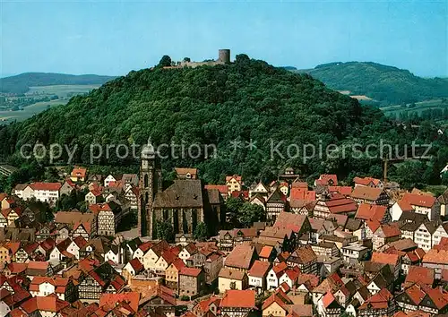 AK / Ansichtskarte Homberg_Efze Stadtbild mit Kirche und Burgruine Fliegeraufnahme Homberg Efze