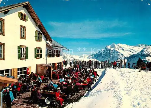 AK / Ansichtskarte Wengen_BE Berggasthaus Maennlichen mit Wetterhorn Berner Alpen Wintersportplatz Sonnenterrasse Wengen_BE