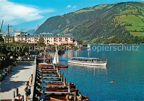 AK / Ansichtskarte Zell_See Seepromenade mit Grand Hotel Bootsanleger Ausflugsboot Zell_See