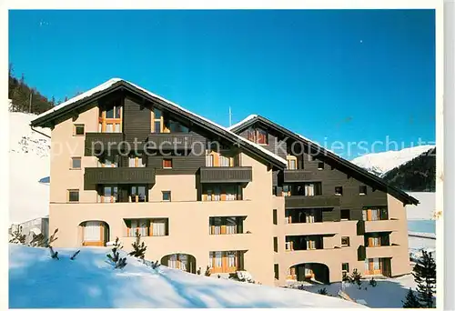 AK / Ansichtskarte Graubuenden_Kanton Appartementhaus Munteratsch im Winter Graubuenden Kanton