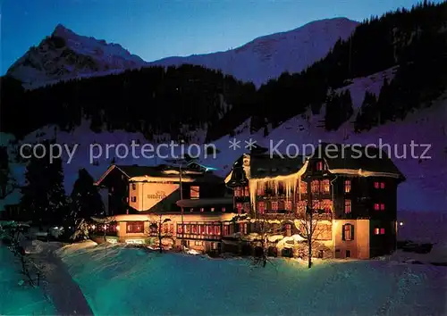 AK / Ansichtskarte Gargellen_Vorarlberg Hotel Madrisa beleuchtet Nachtaufnahme Gargellen_Vorarlberg
