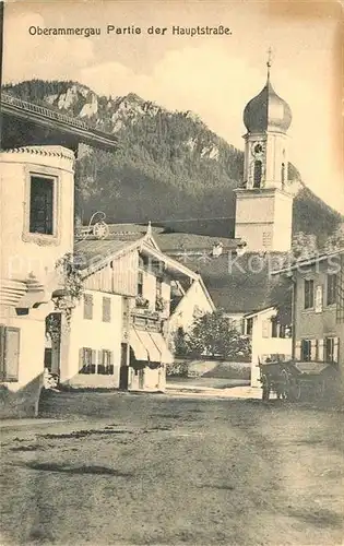 AK / Ansichtskarte Oberammergau Partie der Hauptstrasse mit Kirche Oberammergau