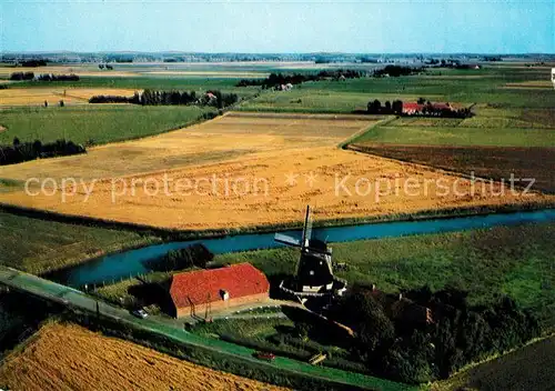 AK / Ansichtskarte Ostfriesland Muehle Landschaftspanorama Fliegeraufnahme Ostfriesland
