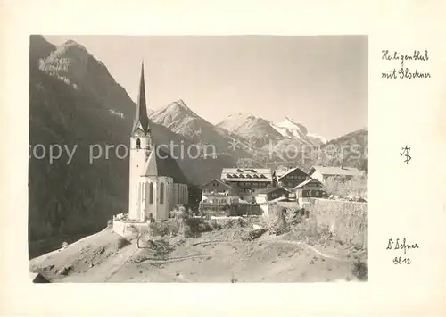 AK / Ansichtskarte Heiligenblut_Kaernten Ortsansicht mit Kirche Blick zum Grossglockner Hohe Tauern Heiligenblut Kaernten