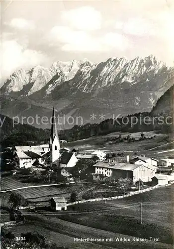 AK / Ansichtskarte Hinterthiersee Ortsansicht mit Kirche Wilder Kaiser Kaisergebirge Hinterthiersee