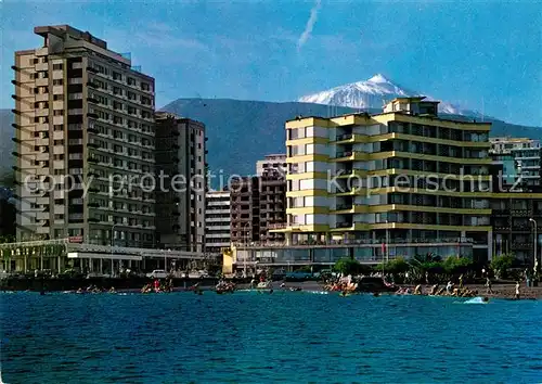 AK / Ansichtskarte Puerto_de_la_Cruz Playa y Hoteles al fondo pico del Teide Apartamentos Martinay Vulkan Puerto_de_la_Cruz