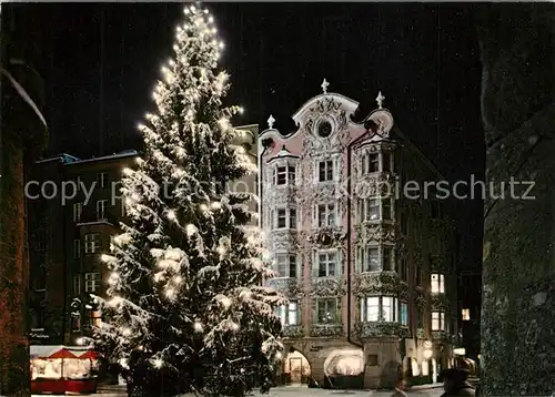 AK / Ansichtskarte Innsbruck Herzog Friedrich Strasse mit Helblinghaus Christbaum Weihnachtszeit Nachtaufnahme Innsbruck