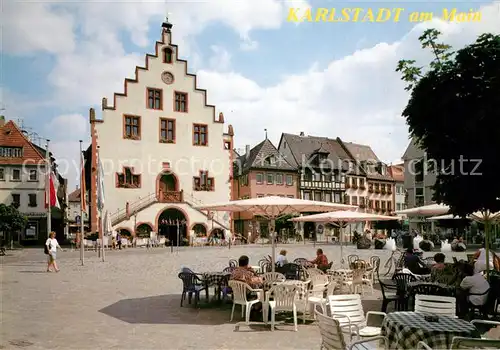 AK / Ansichtskarte Karlstadt_Main Marktplatz Strassencafes Rathaus Giebelhaus Karlstadt_Main