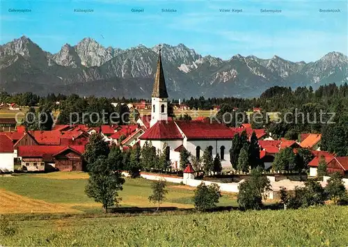 AK / Ansichtskarte Trauchgau Ortsansicht mit Kirche Allgaeuer und Tiroler Alpen Trauchgau