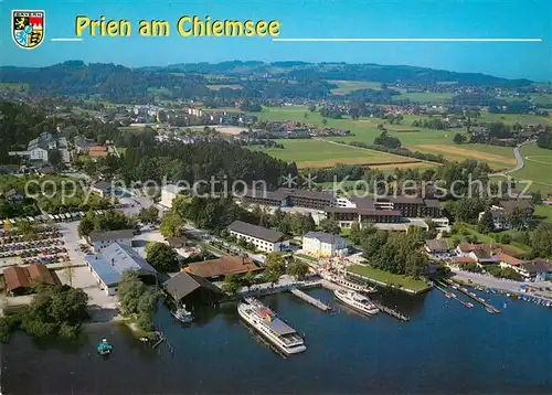 AK / Ansichtskarte Prien_Chiemsee Fliegeraufnahme mit Dampferhafen und Schiffsanlegestelle Prien Chiemsee
