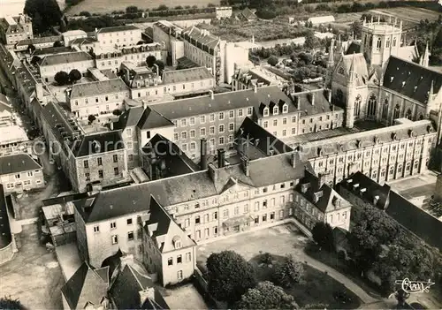 AK / Ansichtskarte Begard Vue aerienne Entree principale de lHopital et Chapelle Bon Sauveur Begard
