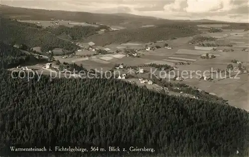 AK / Ansichtskarte Warmensteinach Panorama Blick zum Geiersberg Fliegeraufnahme Warmensteinach