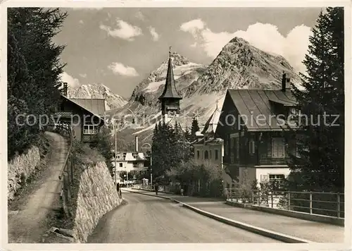 AK / Ansichtskarte Arosa_GR Dorfkirche Panorama Arosa_GR