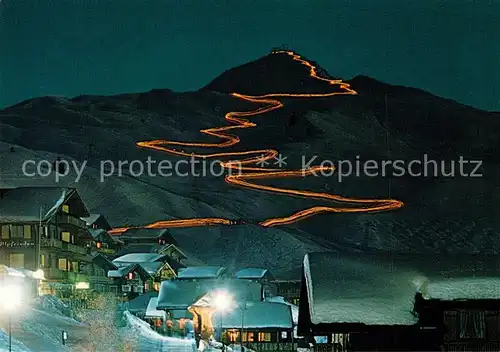 AK / Ansichtskarte Bettmeralp_VS Flammenabfahrt vom Wurzenbord Wintersportplatz Nachtaufnahme Bettmeralp VS