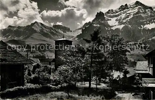 AK / Ansichtskarte Adelboden Kirche mit Bunderspitz und Nuenihorn Berner Alpen Adelboden