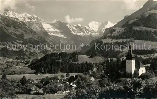 AK / Ansichtskarte Frutigen_BE Ortsansicht mit Kirche Blick zu Doldenhorn Balmhorn Altels Berner Alpen Frutigen BE