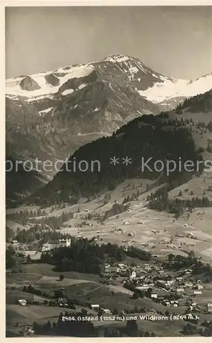 AK / Ansichtskarte Gstaad Panorama mit Blick zum Wildhorn Berner Alpen Gstaad