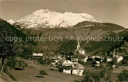 AK / Ansichtskarte Fiesch Ortsansicht mit Blick zum Finsteraarrothorn Berner Alpen Fiesch