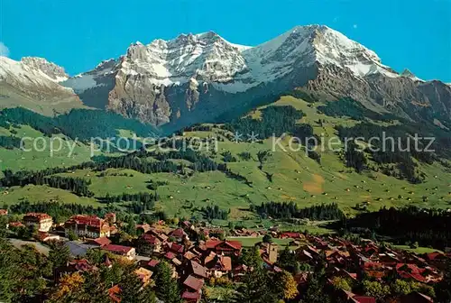 AK / Ansichtskarte Adelboden Panorama mit Kleinlohner Grosslohner und Tschingelochtighorn Berner Alpen Fliegeraufnahme Adelboden
