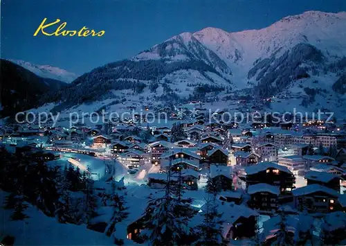 AK / Ansichtskarte Klosters_GR Wintersportplatz Alpen Nachtaufnahme Klosters_GR