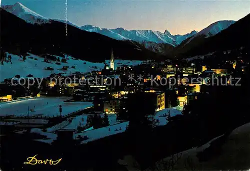 AK / Ansichtskarte Davos_GR Wintersportplatz Alpen bei Nacht Davos_GR
