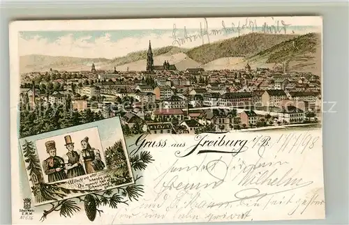 AK / Ansichtskarte Freiburg_Breisgau Stadt mit Muenster Schwarzwaldtrachten Freiburg Breisgau