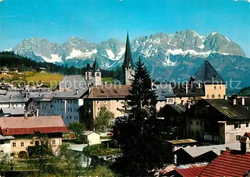 AK / Ansichtskarte Kitzbuehel_Tirol Ortsmotiv mit Kirche Blick gegen Wilden Kaiser Kaisergebirge Kitzbuehel Tirol