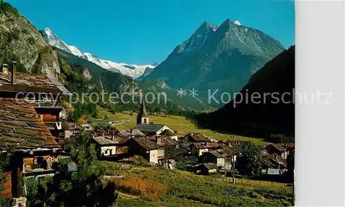 AK / Ansichtskarte Evolene Dorfansicht mit Kirche Dent Blanche Dents de Veisivi Dent Perroc Alpen Evolene