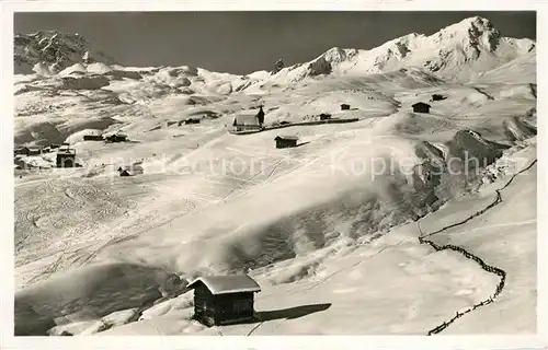 AK / Ansichtskarte Inner_Arosa Skifelder mit Bergkirchli Inner Arosa
