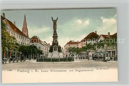 AK / Ansichtskarte Freiburg_Breisgau Kaiser Wilhelmsplatz und Siegesdenkmal Strassenbahn Freiburg Breisgau