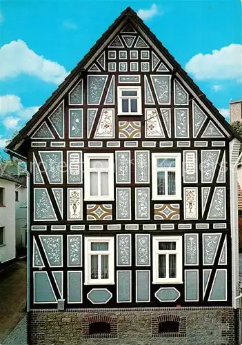 AK / Ansichtskarte Holzhausen_Huenstein Kratzputzhaus Fachwerkhaus Historisches Gebaeude Holzhausen_Huenstein