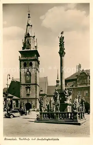 AK / Ansichtskarte Komotau Stadtkirche Dreifaltigkeitssaeule Komotau