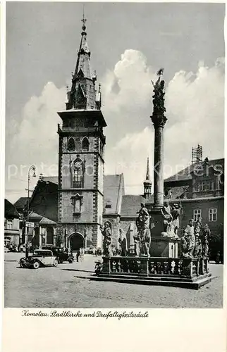 AK / Ansichtskarte Komotau Stadtkirche Dreifaltigkeitssaeule Komotau