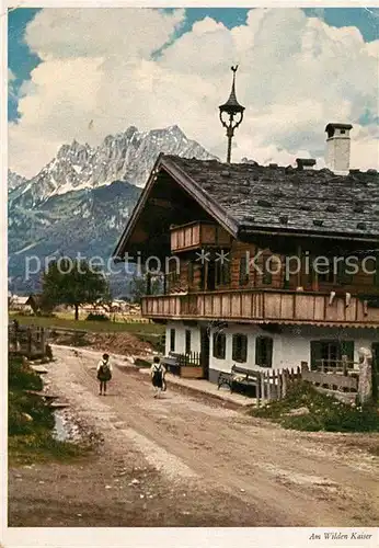 AK / Ansichtskarte St_Johann_Tirol Dorfmotiv mit Wildem Kaiser St_Johann_Tirol
