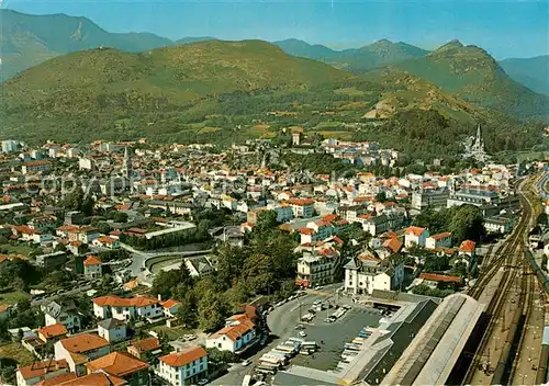 AK / Ansichtskarte Lourdes_Hautes_Pyrenees Vue generale aerienne La Gare La Basilique Eglise du Sacre Coeur Lourdes_Hautes_Pyrenees