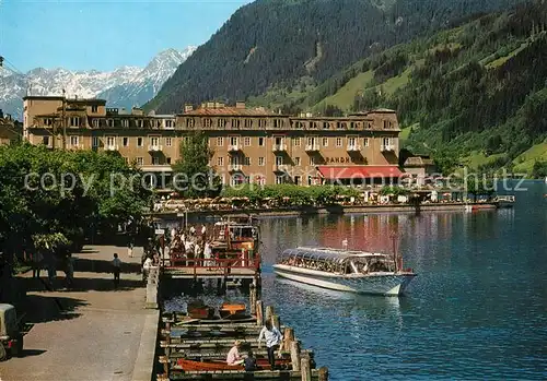 AK / Ansichtskarte Zell_See Seepromenade mit Grand Hotel Fahrgastschiff Steinernes Meer Zell_See