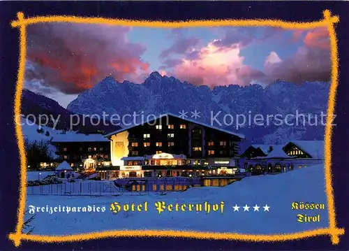 AK / Ansichtskarte Koessen_Tirol Freizeitparadies Hotel Peternhof im Winter Abendstimmung Alpen Koessen Tirol