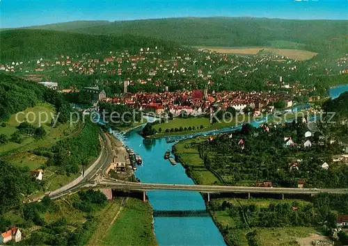 AK / Ansichtskarte Hann._Muenden Weserbruecke mit Stadtblick Fliegeraufnahme Hann. Muenden