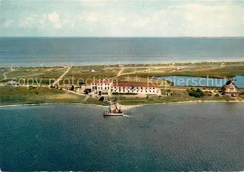 AK / Ansichtskarte Heiligenhafen_Ostseebad Steinwarder mit Duenenhotel Fliegeraufnahme Heiligenhafen_Ostseebad