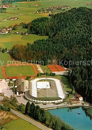 AK / Ansichtskarte Inzell Eisstadion mit Sportplatz und Tennisanlage Fliegeraufnahme Inzell