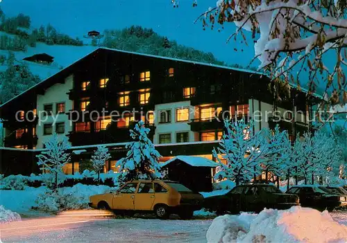 AK / Ansichtskarte Kaprun Sporthotel Winter Abend Kaprun