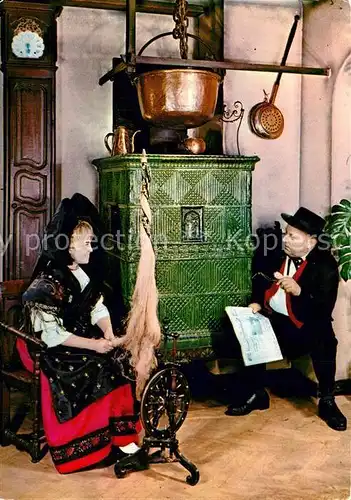 AK / Ansichtskarte Trachten_Alsace Kachelofen Spinnrad  